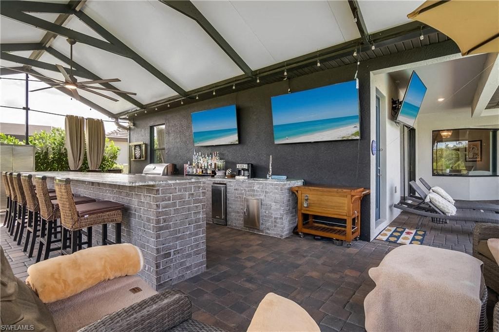 a patio with a bar and a living room