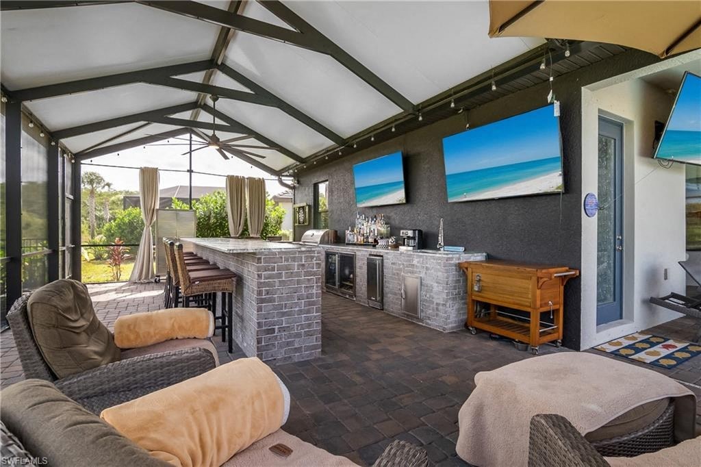 a patio with a bar and a living room