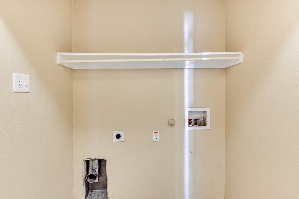 the door to the bathroom is open and the light is on