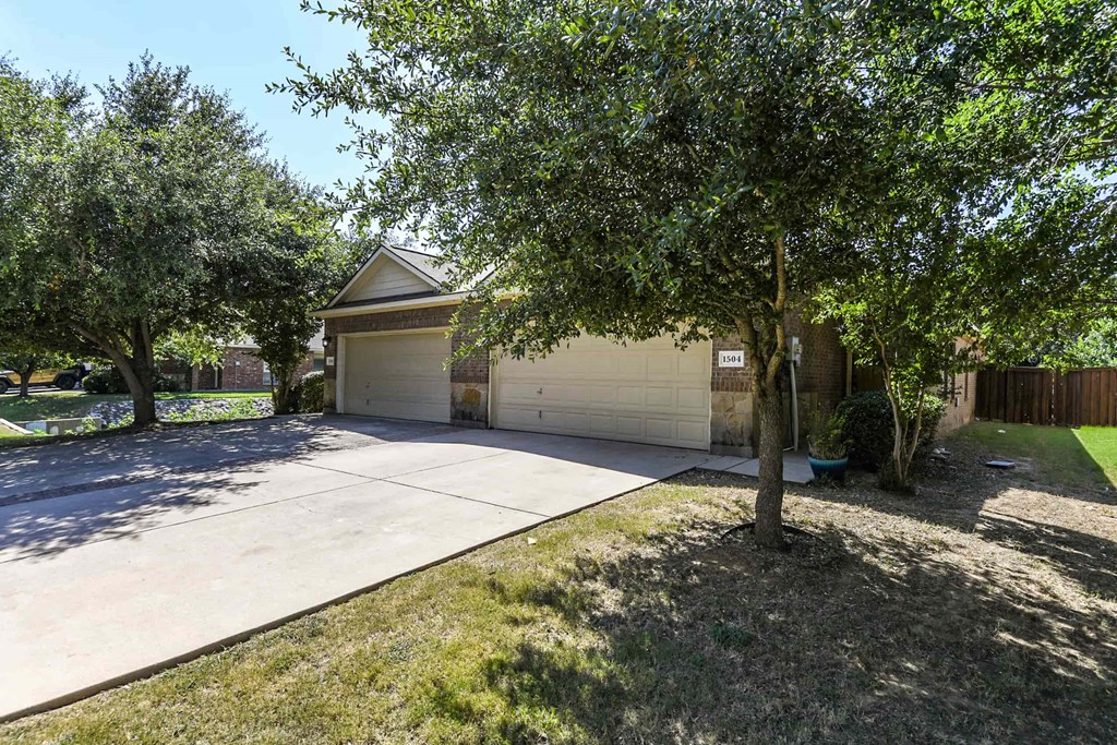 a house with a driveway and a garage door