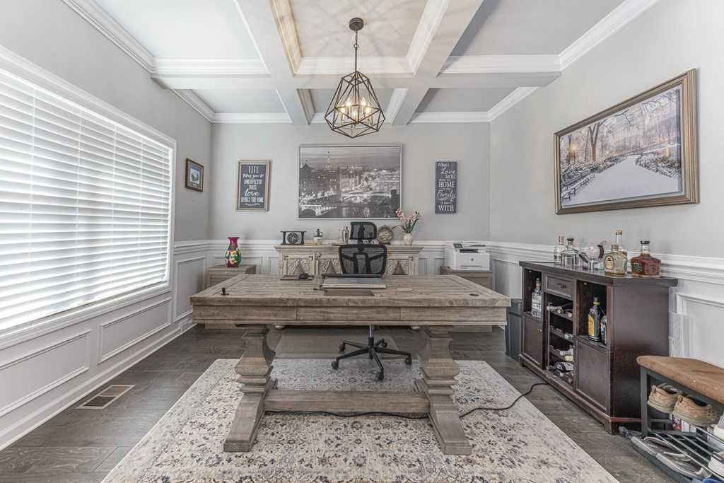 a dining room with a large wooden table and a large window