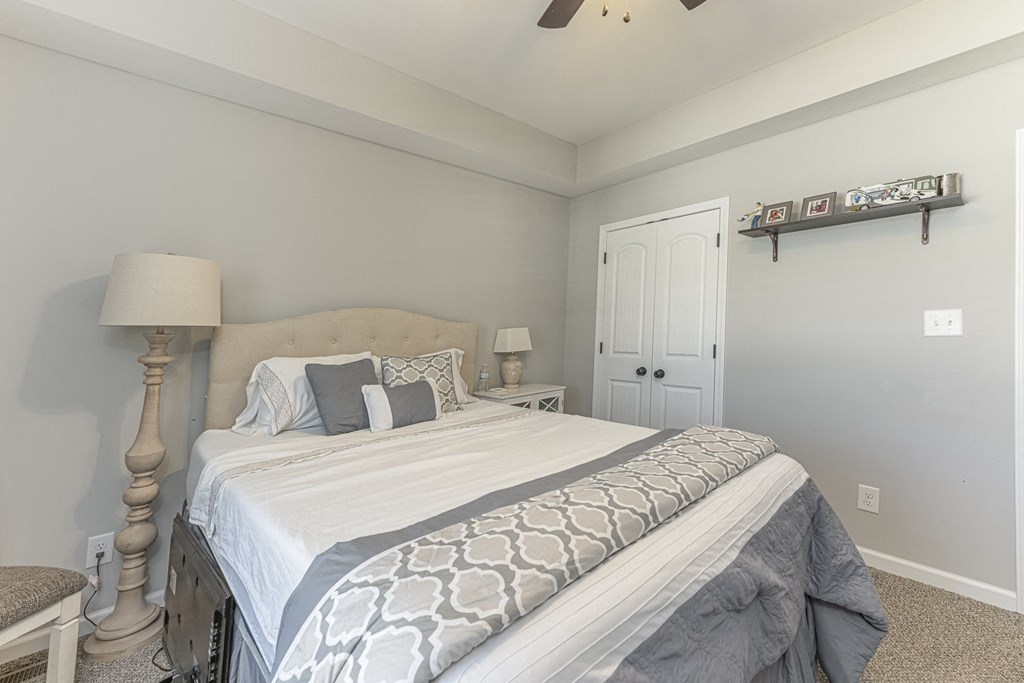 a bedroom with a large bed and a closet