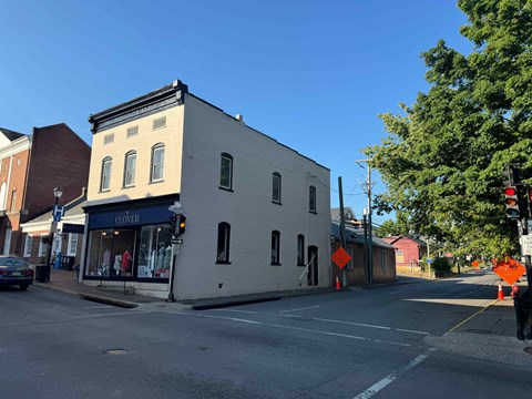 a white building on the corner of a street