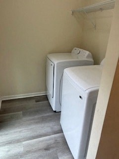 two washers and a dryer in a small room