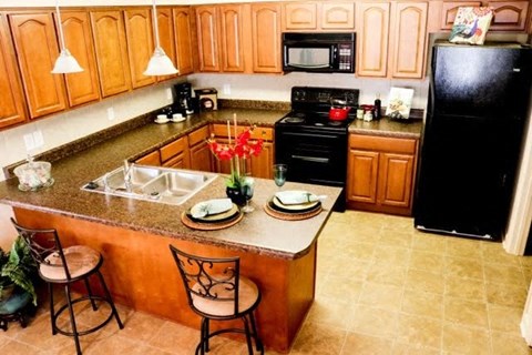 a kitchen with a sink and a counter top