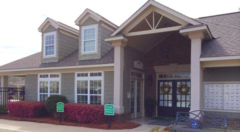 a building with two parking signs in front of it