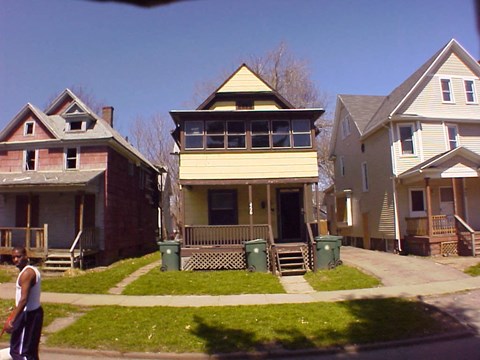 a couple of houses on a street