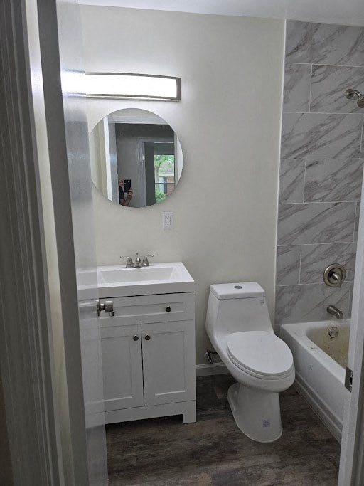a bathroom with a toilet and a sink and a mirror