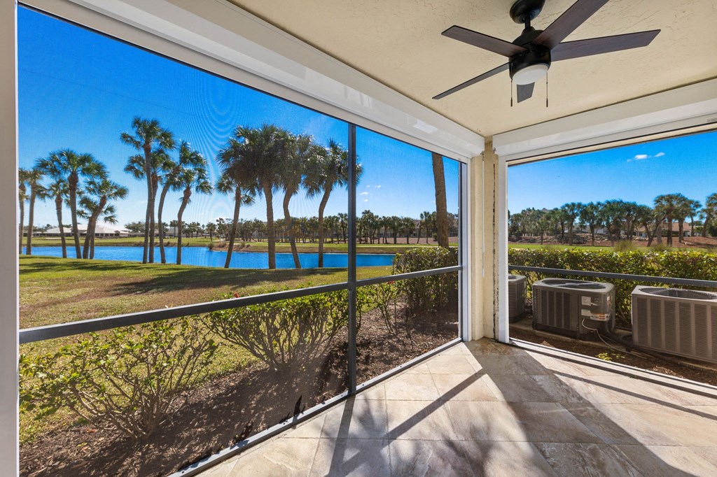 the view from the balcony of a house overlooking a lake