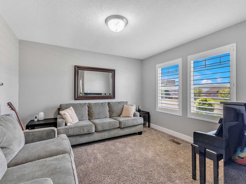 a living room with a couch and a tv