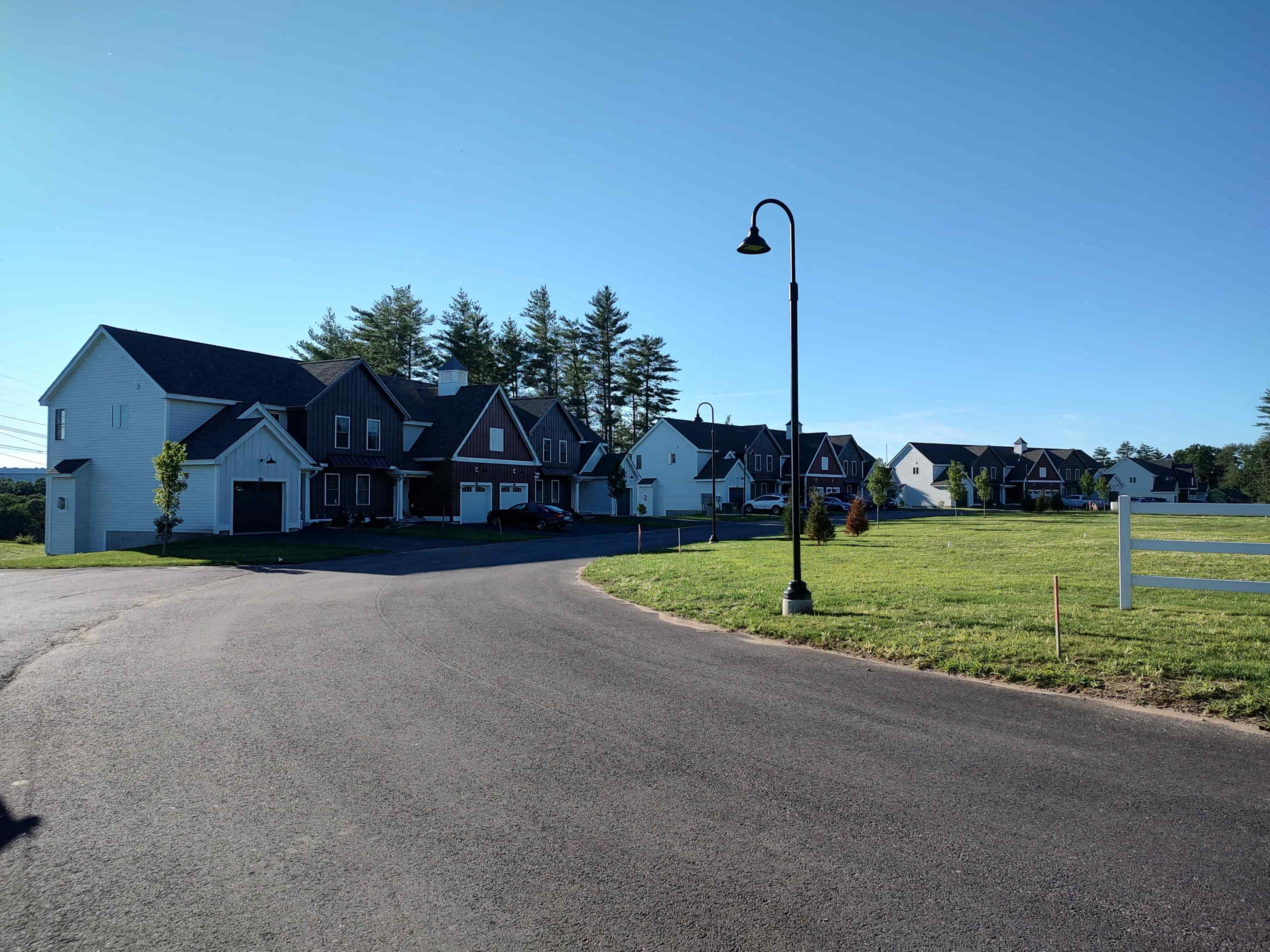 a street with houses on the side of a road