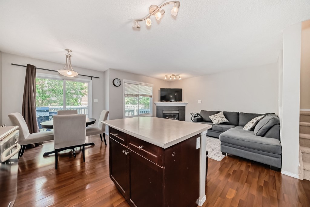 a living room with a kitchen and a couch