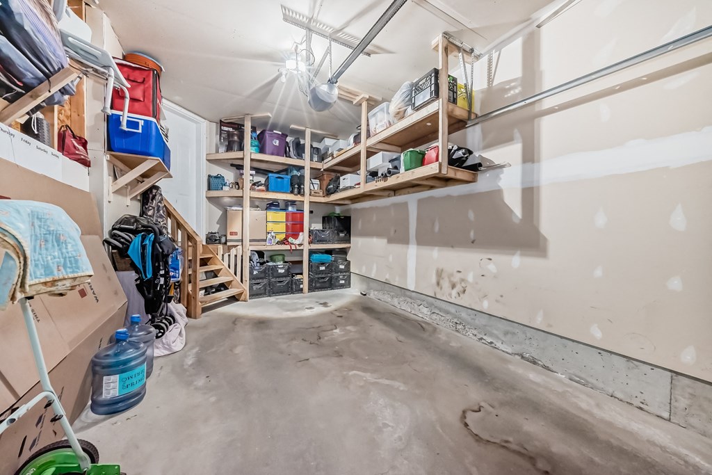 a room that is being remodeled with a lot of shelving and a wall
