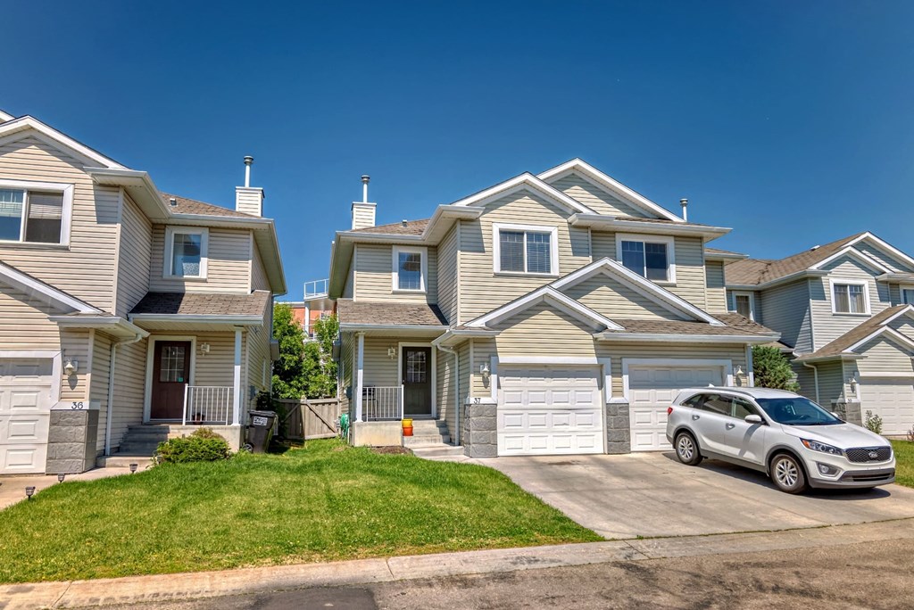 a house with a car parked in front of it