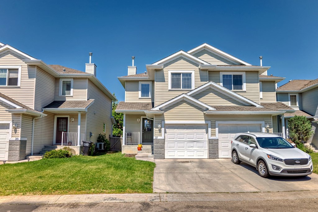 a house with a car parked in front of it