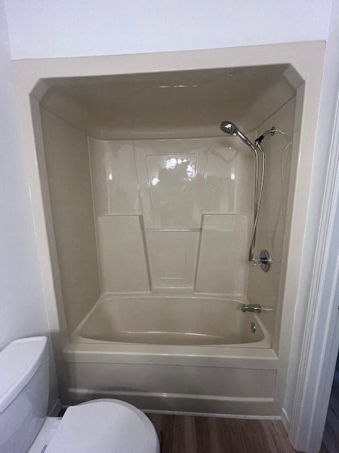 a small bathroom with a shower and a toilet