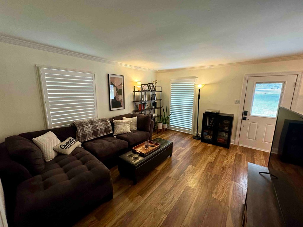 a living room with a couch and a tv