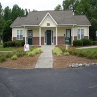 a house with a sign in front of it