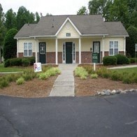 a house with a sign in front of it