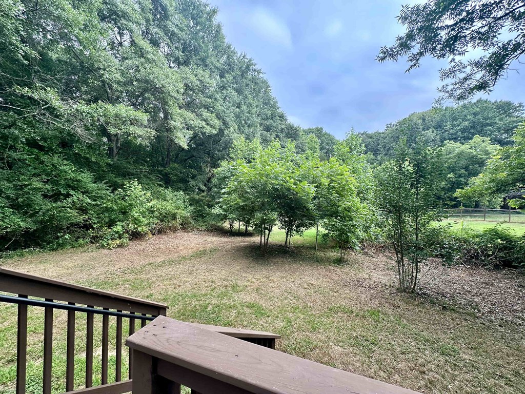 the view from the deck of a cabin in the woods