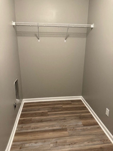 a empty room with wooden floors and a closet