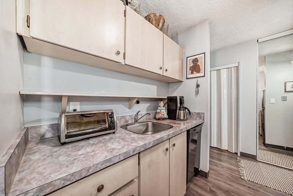 a kitchen with a sink and a microwave
