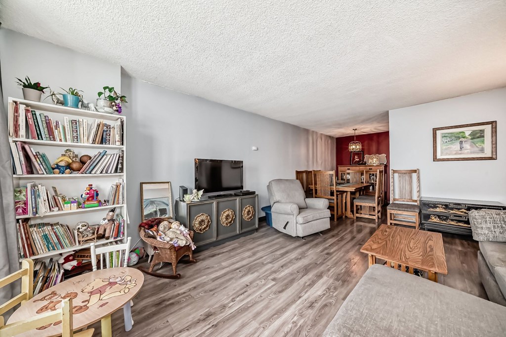 a living room with a couch and a table and a tv