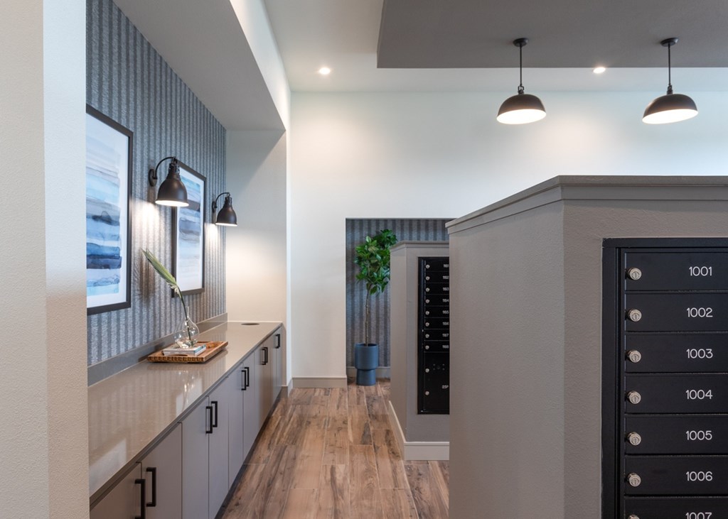 a hallway with a counter top and a door to a wine cellar in a house
