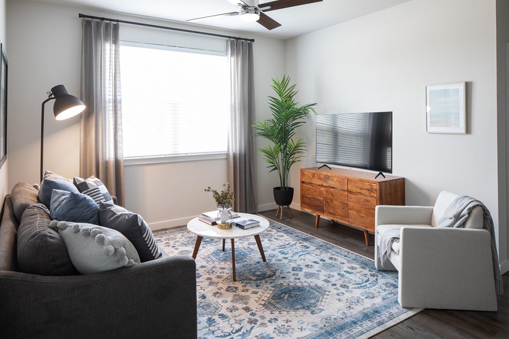 a living room with a couch and a tv