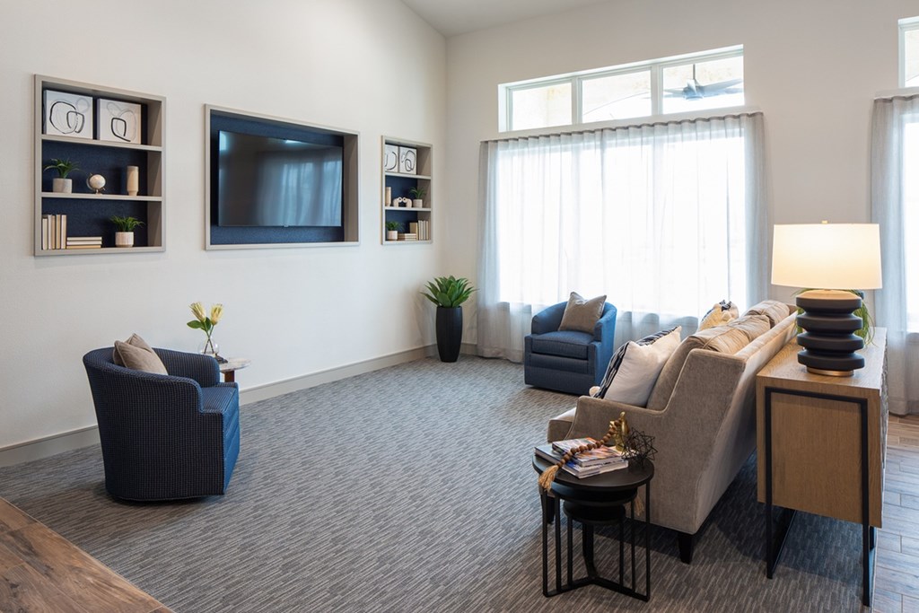 a living room with a couch and a tv