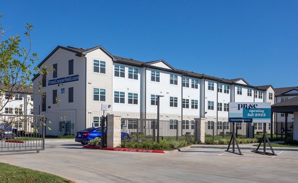 a large white building with a sign in front of it
