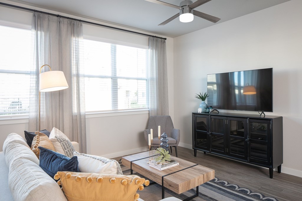 a living room with a couch and a tv