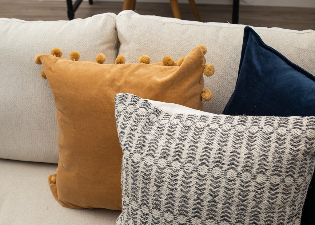 a group of pillows sitting on a couch
