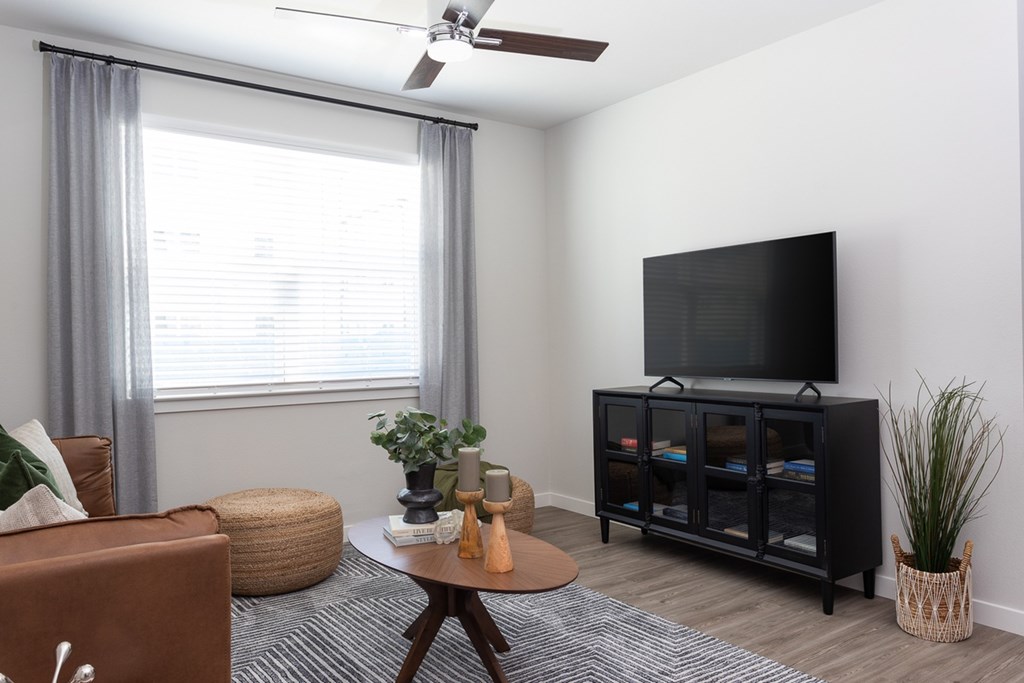 a living room with a couch and a tv