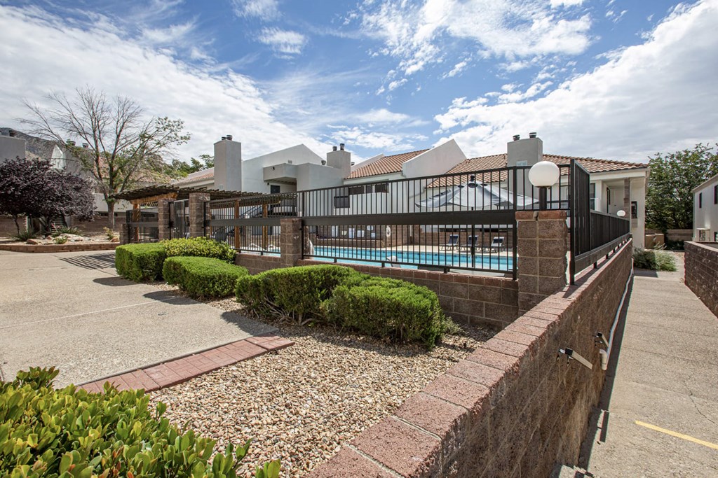 a house with a pool and a fence