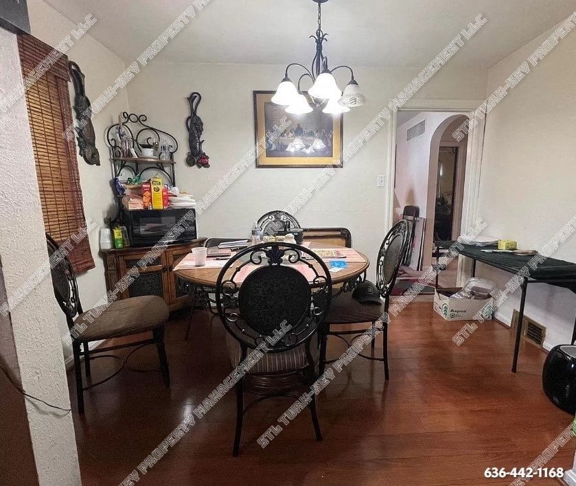 a dining room with a table and chairs