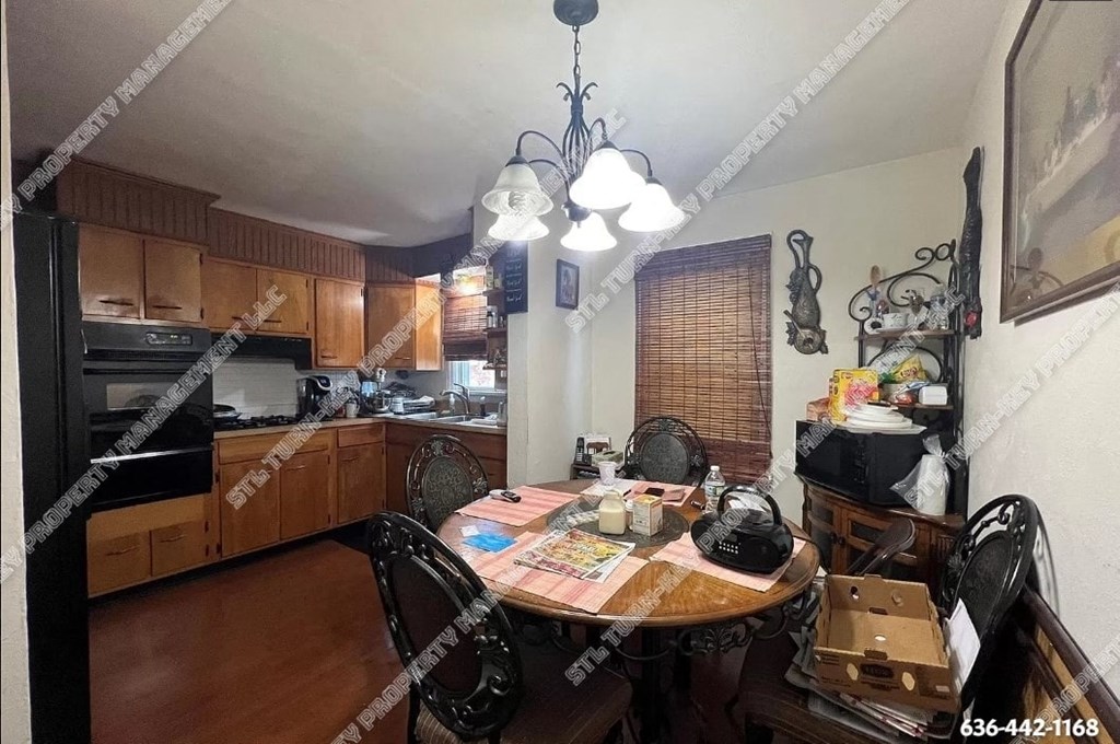 a kitchen and dining room with a table and chairs