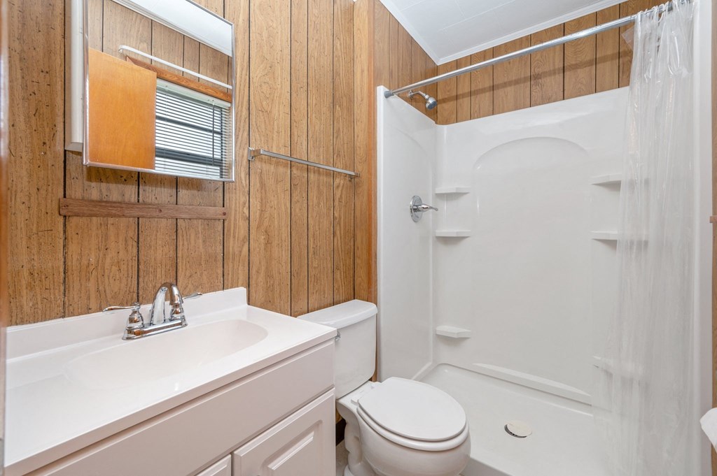 a bathroom with a toilet and a sink
