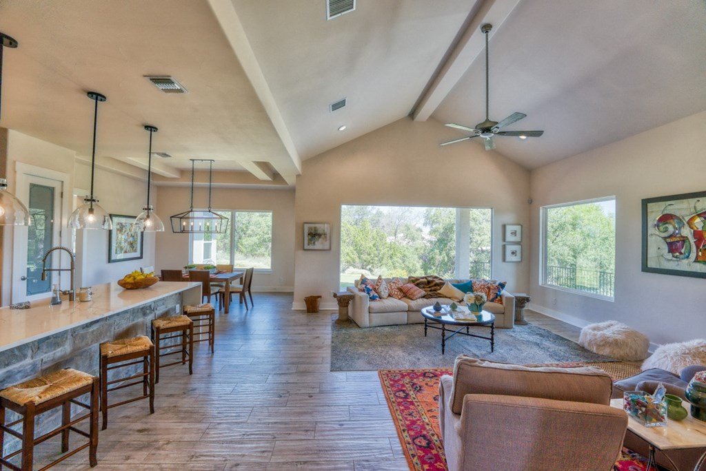 the view of the living room and dining room from the kitchen
