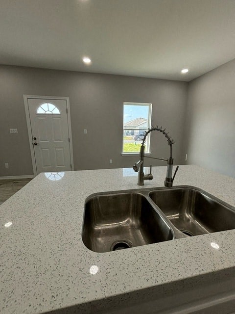 a kitchen with a sink and a counter top