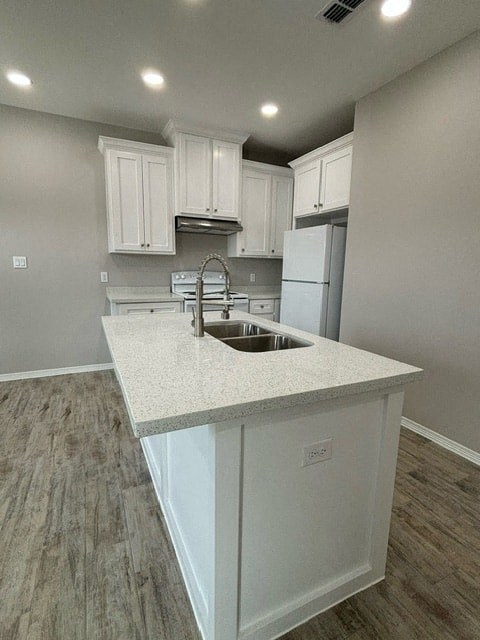 a kitchen with a sink and a counter top