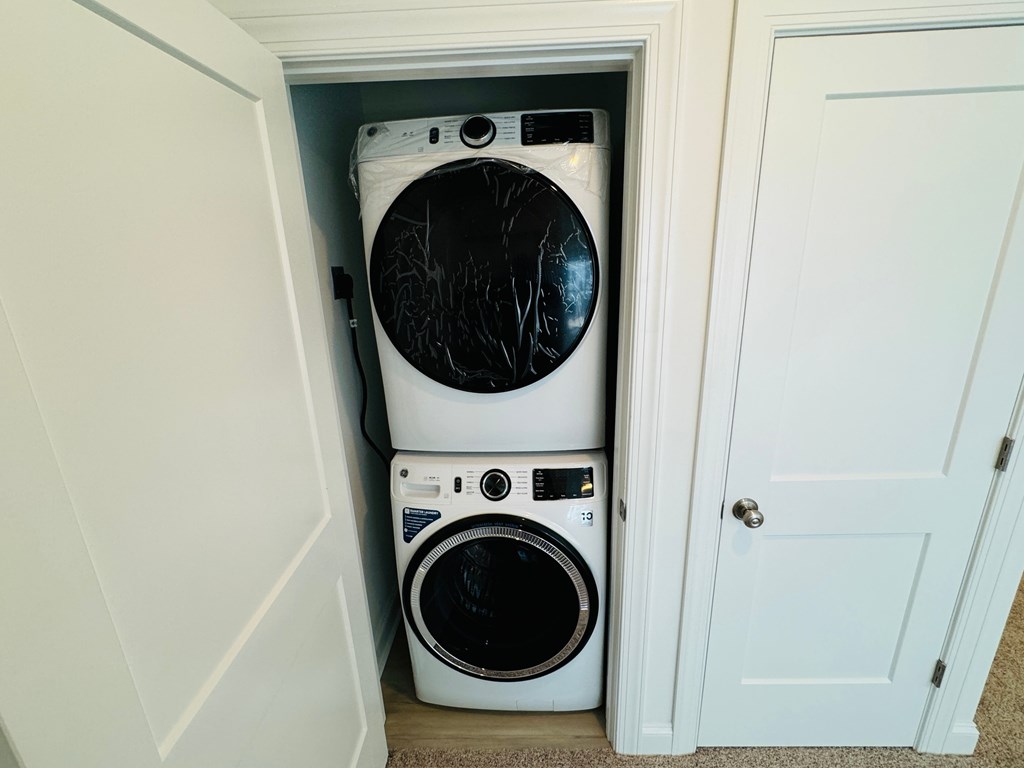 a small laundry room with a washer and a dryer