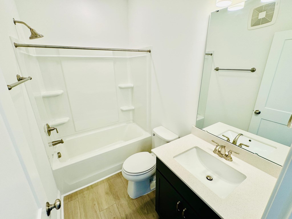 a bathroom with a sink toilet and a shower