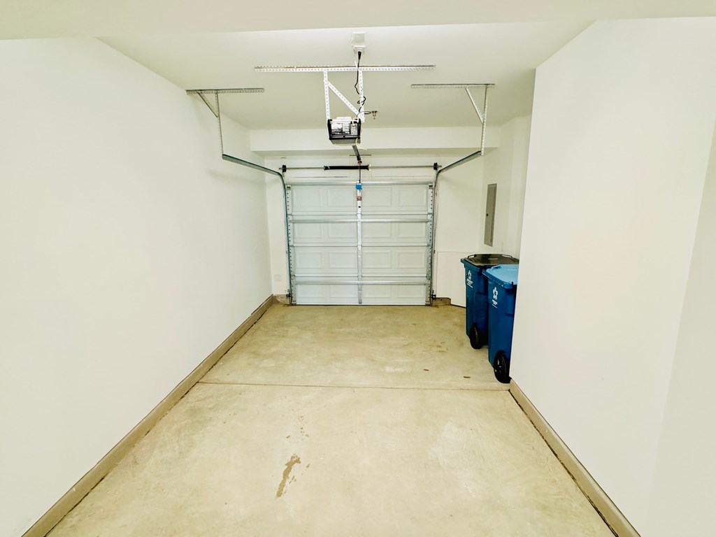 a room with white walls and a white garage door