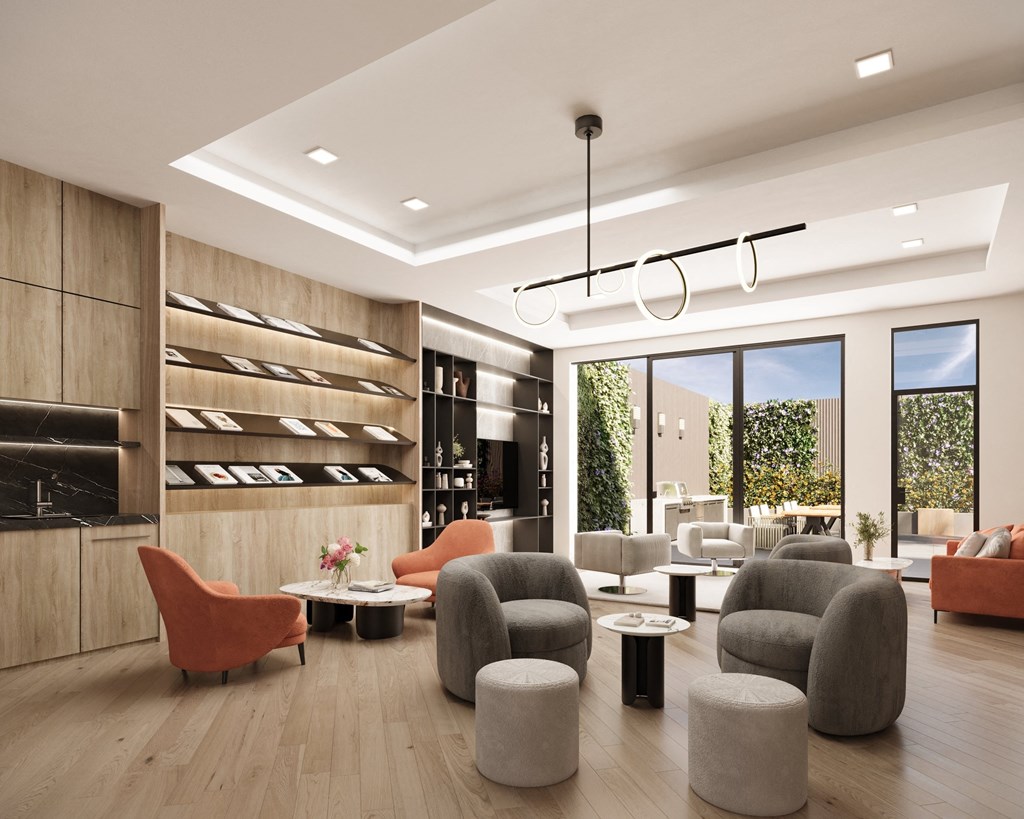 a living room with chairs and tables and a large window