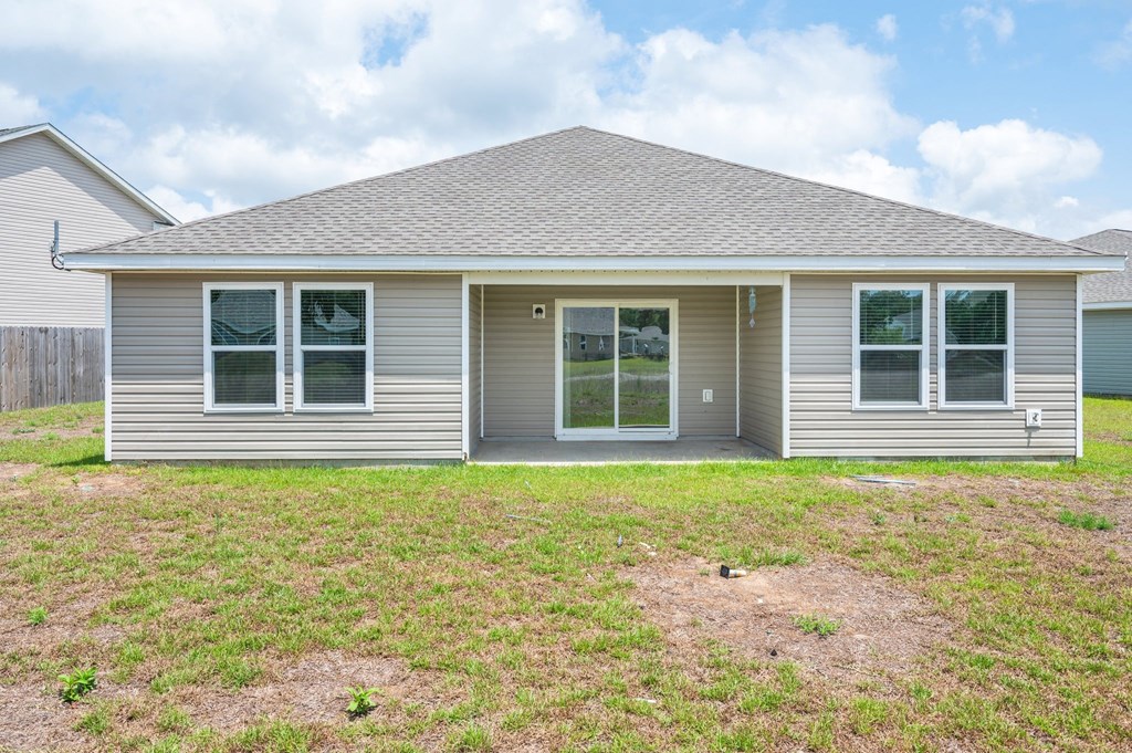 a small house with a yard in front of it