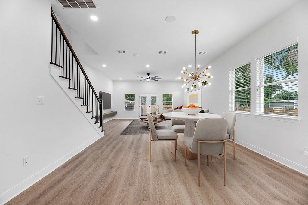 a dining room with a table and chairs