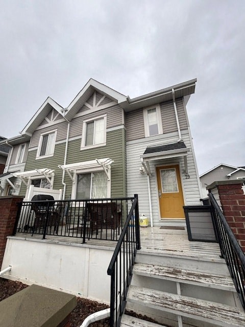 a with a yellow door and stairs