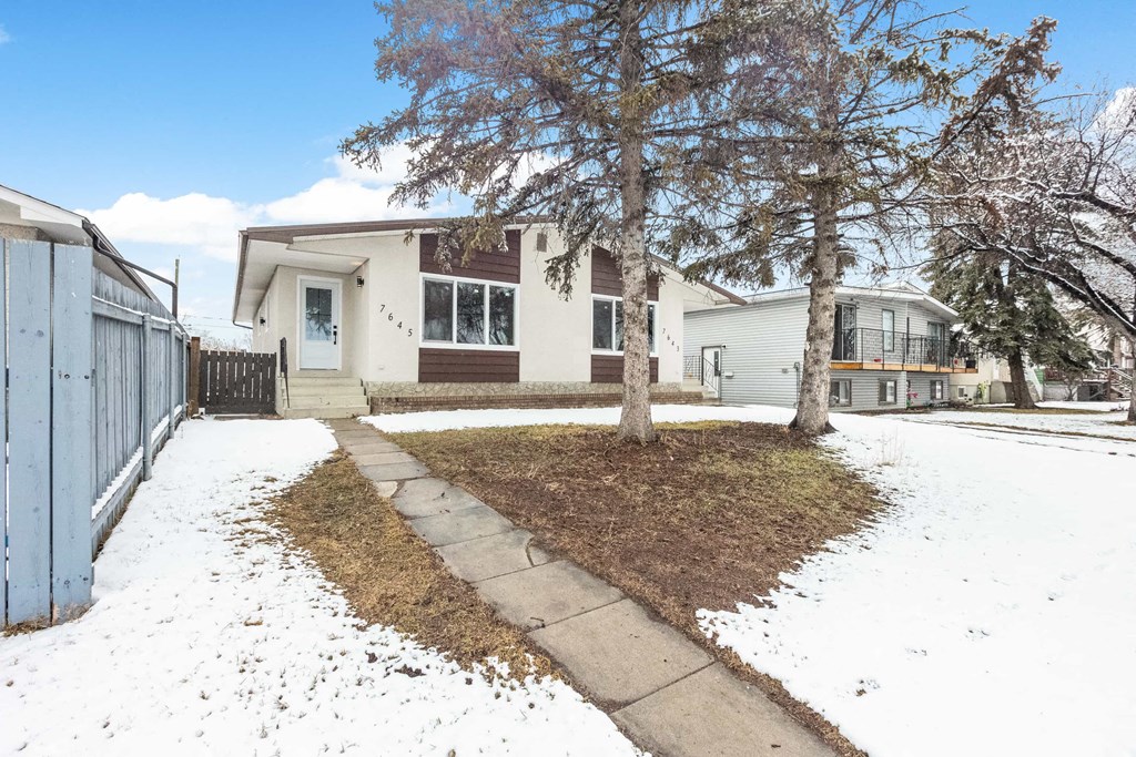 the front of the house in the snow