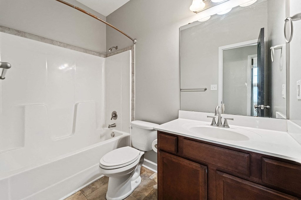 a bathroom with a sink toilet and a shower